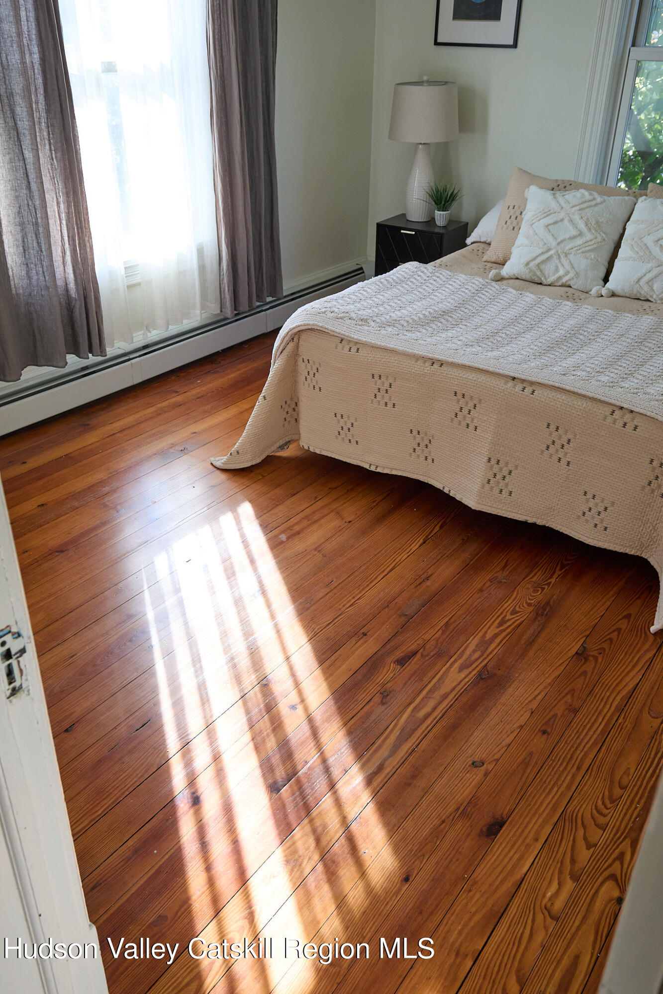 70 Store Road Accord, NY 12404 - Photo 28 of 43 a bedroom with a bed and wooden floor