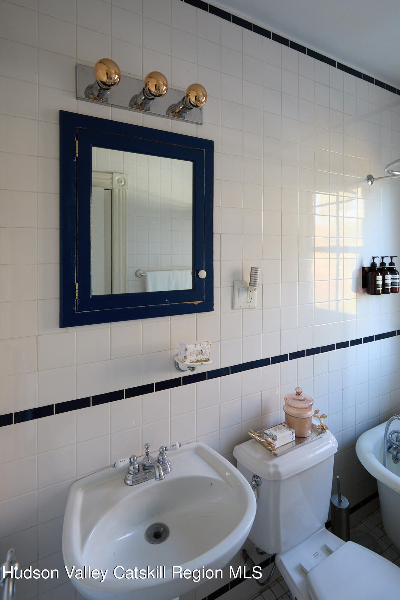 70 Store Road Accord, NY 12404 - Photo 31 of 43 a bathroom with a toilet sink and mirror
