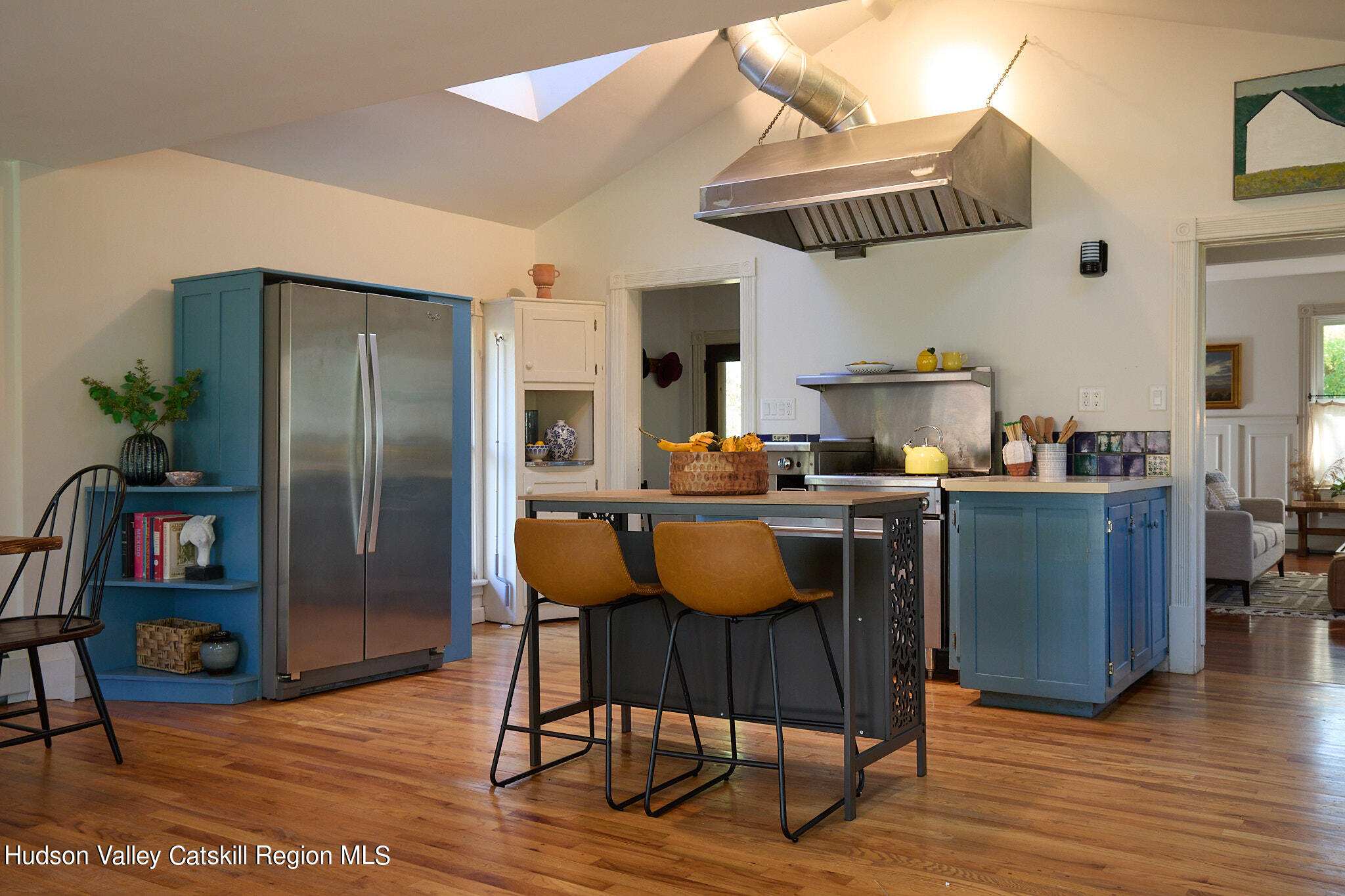 70 Store Road Accord, NY 12404 - Photo 7 of 43 a kitchen with stainless steel appliances granite countertop a refrigerator a sink dishwasher a dining table and chairs with wooden floor
