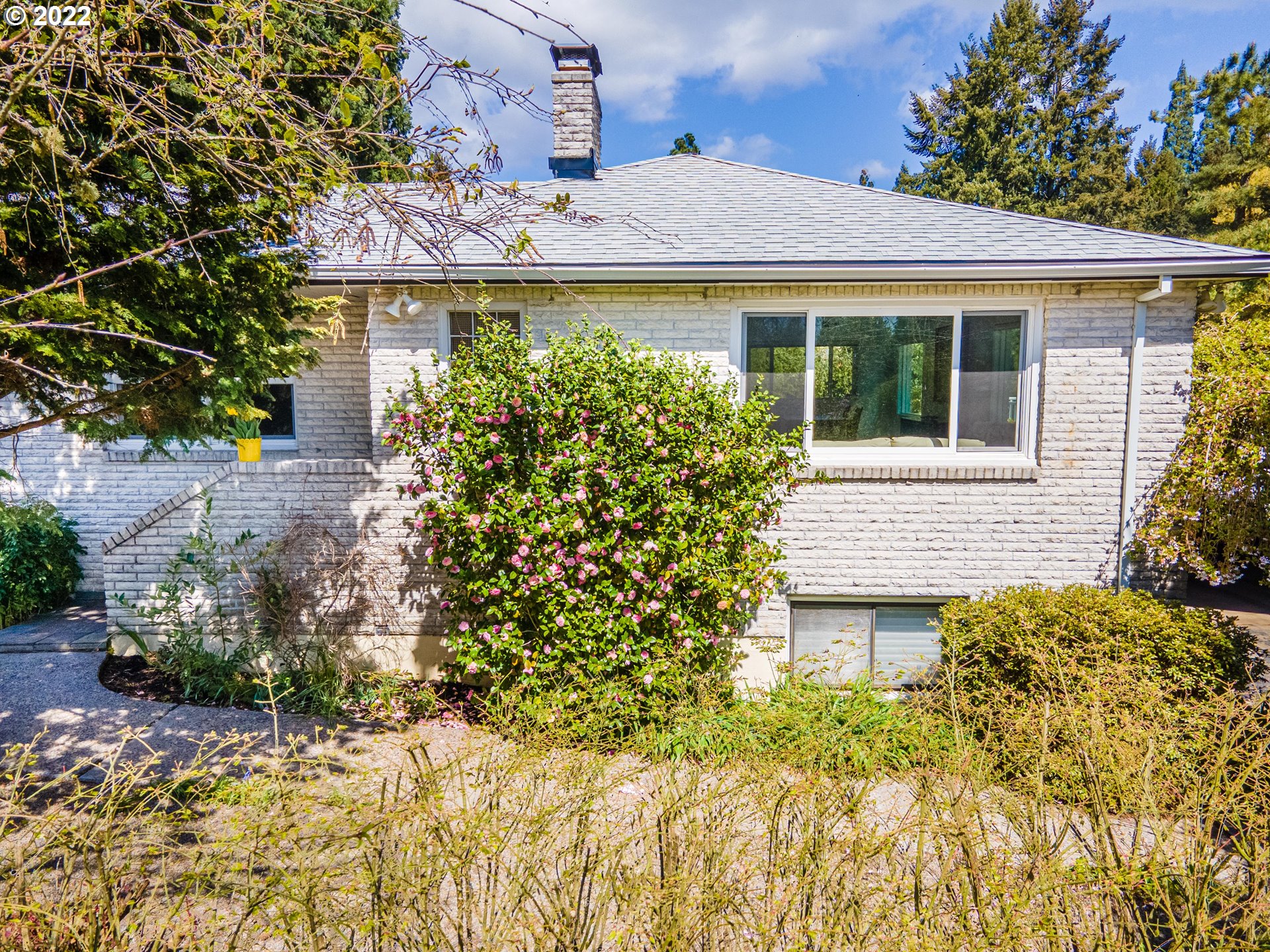 135 South Ridge Drive Portland, OR 97219 - Photo 2 of 32 a view of a house with potted plants