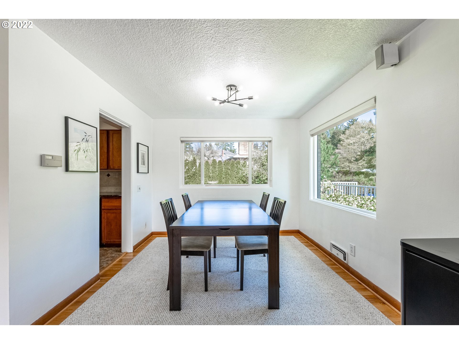 135 South Ridge Drive Portland, OR 97219 - Photo 9 of 32 a view of a dining room with furniture window and wooden floor