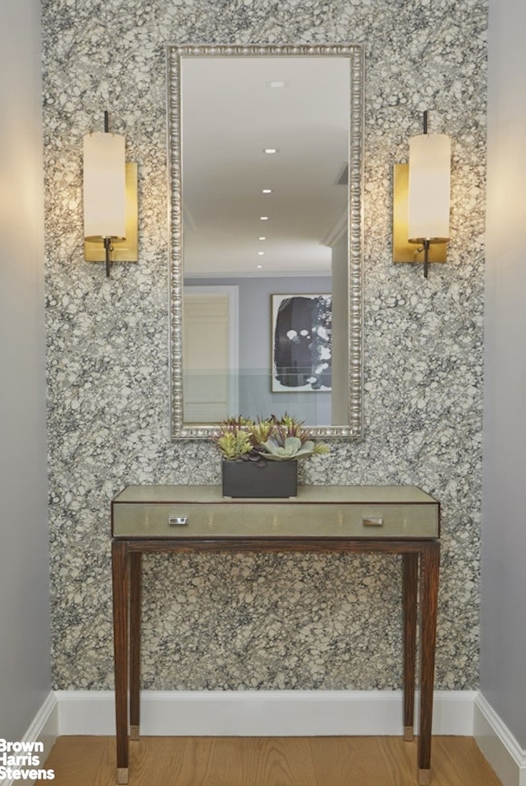 150 East 69th Street, Unit 4M Manhattan, NY 10021 - Photo 10 of 24 a bathroom with a sink and a mirror