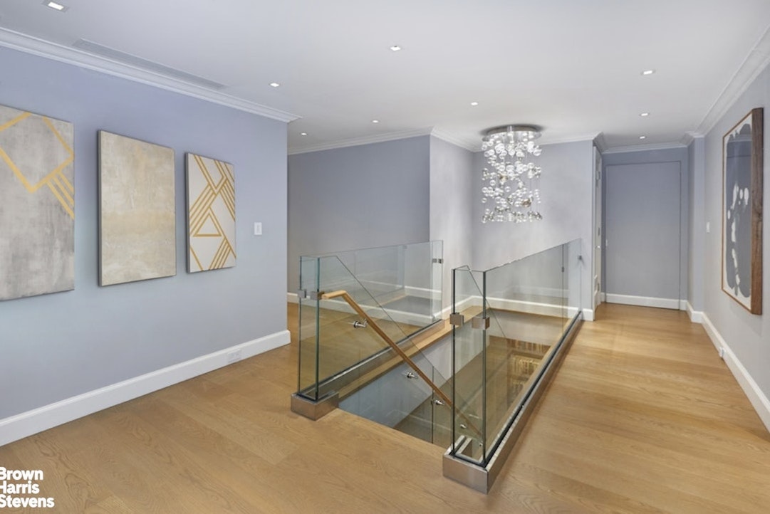 150 East 69th Street, Unit 4M Manhattan, NY 10021 - Photo 12 of 24 a view of a livingroom with furniture and a window