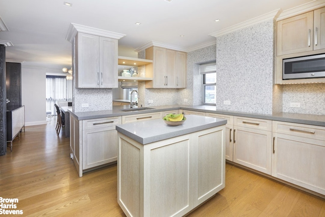 150 East 69th Street, Unit 4M Manhattan, NY 10021 - Photo 13 of 24 a view of a kitchen with cabinets