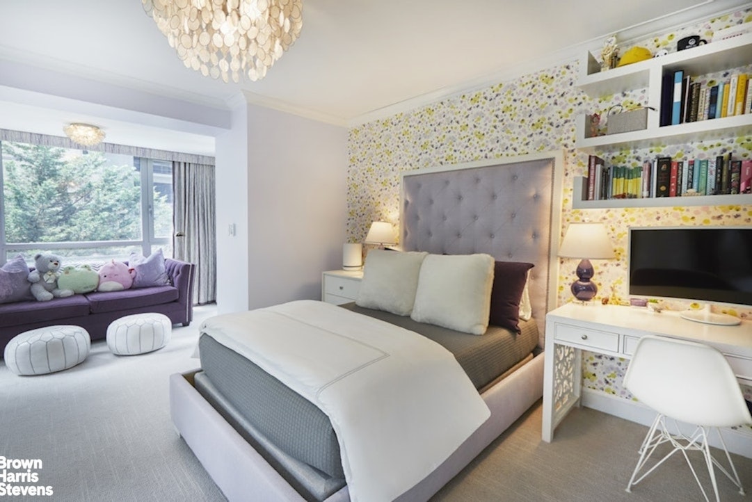 150 East 69th Street, Unit 4M Manhattan, NY 10021 - Photo 20 of 24 a bedroom with a bed and a flat screen tv