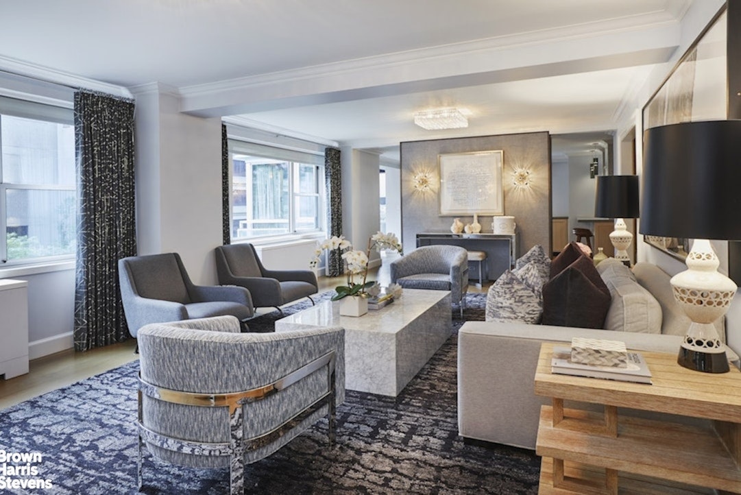 150 East 69th Street, Unit 4M Manhattan, NY 10021 - Photo 3 of 24 a living room with furniture fireplace and a window