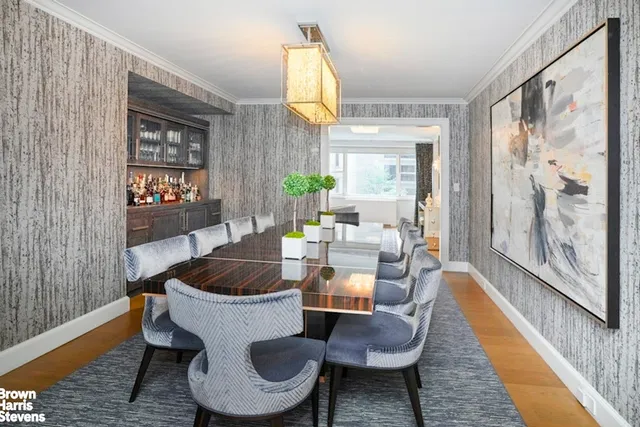 a living room with furniture fireplace and a window