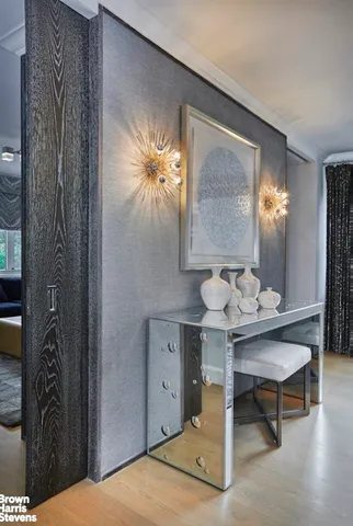 a bedroom with furniture and a large window