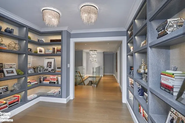 a bathroom with a granite countertop toilet sink and mirror