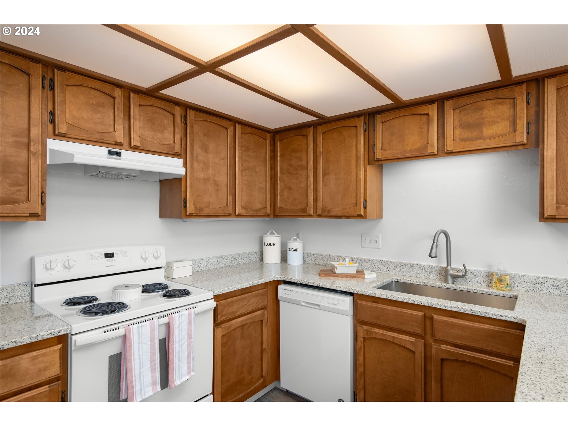 650 Harlow Road, Unit 202 Springfield, OR 97477 - Photo 12 of 34 a kitchen with stainless steel appliances granite countertop a sink stove and cabinets