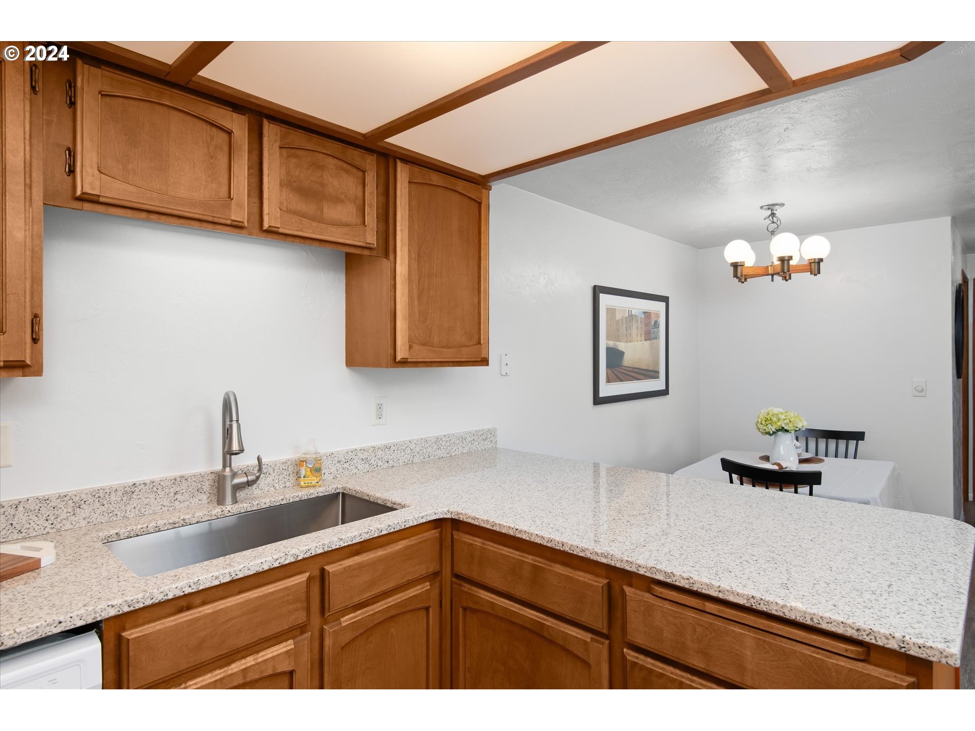 650 Harlow Road, Unit 202 Springfield, OR 97477 - Photo 13 of 34 a kitchen with stainless steel appliances granite countertop a sink and a white cabinets