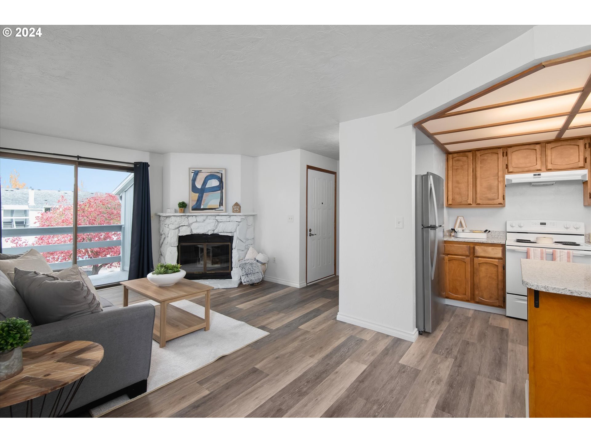 650 Harlow Road, Unit 202 Springfield, OR 97477 - Photo 14 of 34 a living room with furniture and a fireplace