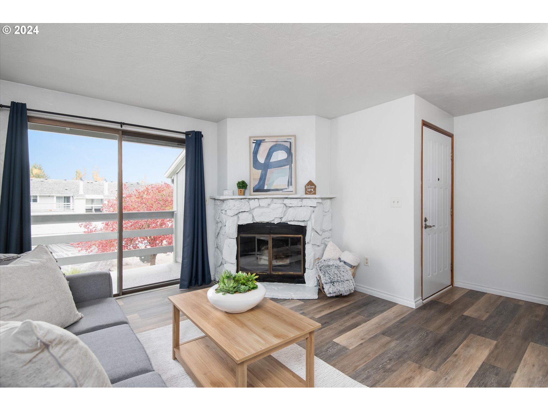 650 Harlow Road, Unit 202 Springfield, OR 97477 - Photo 3 of 34 a living room with furniture and a fireplace