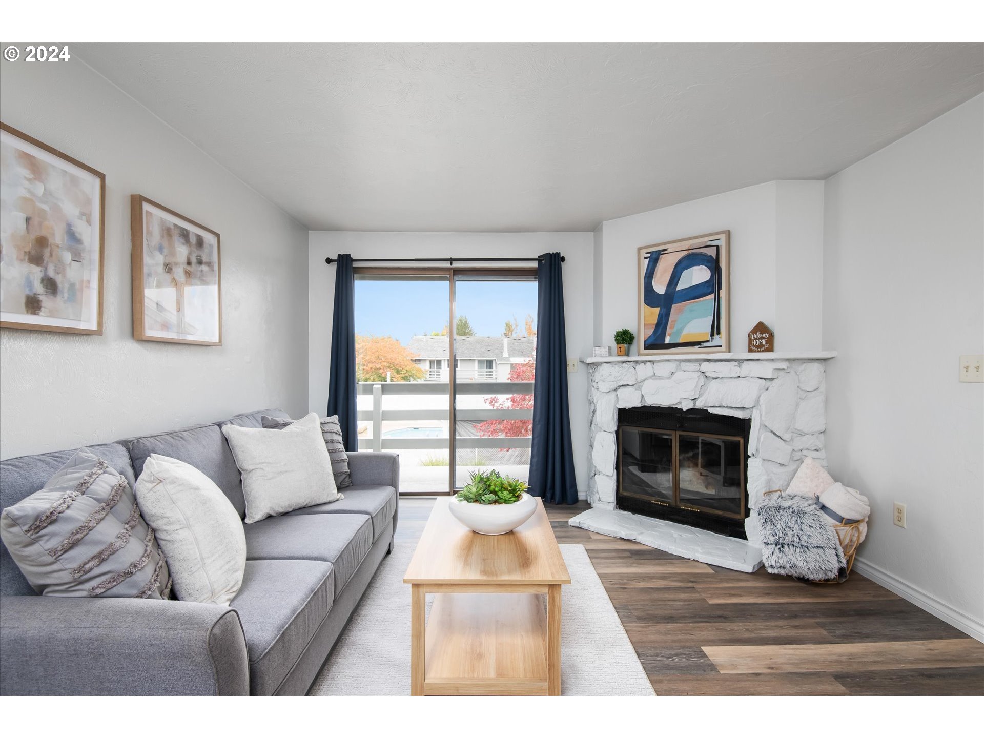 650 Harlow Road, Unit 202 Springfield, OR 97477 - Photo 4 of 34 a living room with furniture and a fireplace