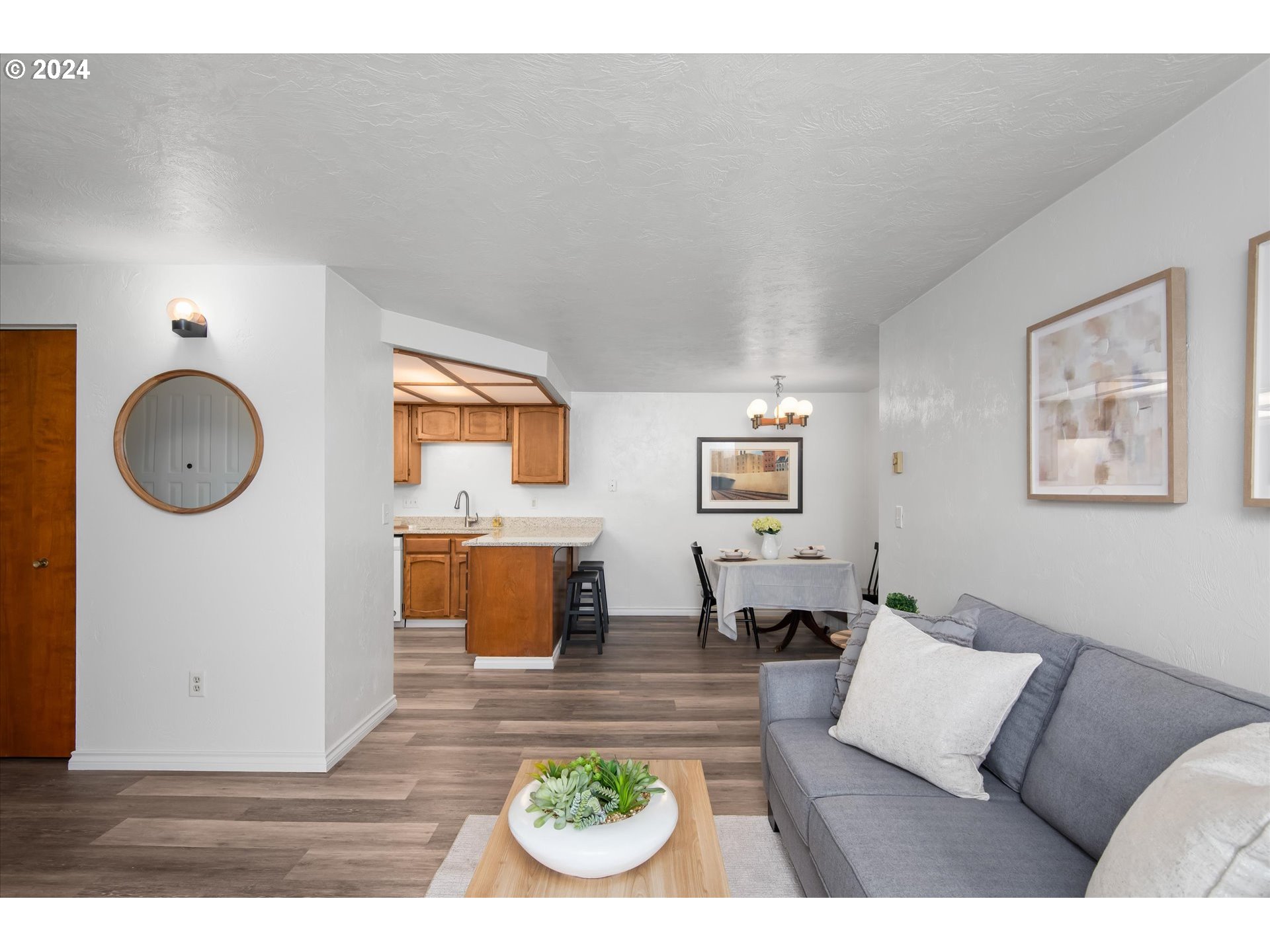 650 Harlow Road, Unit 202 Springfield, OR 97477 - Photo 7 of 34 a living room with furniture and a table