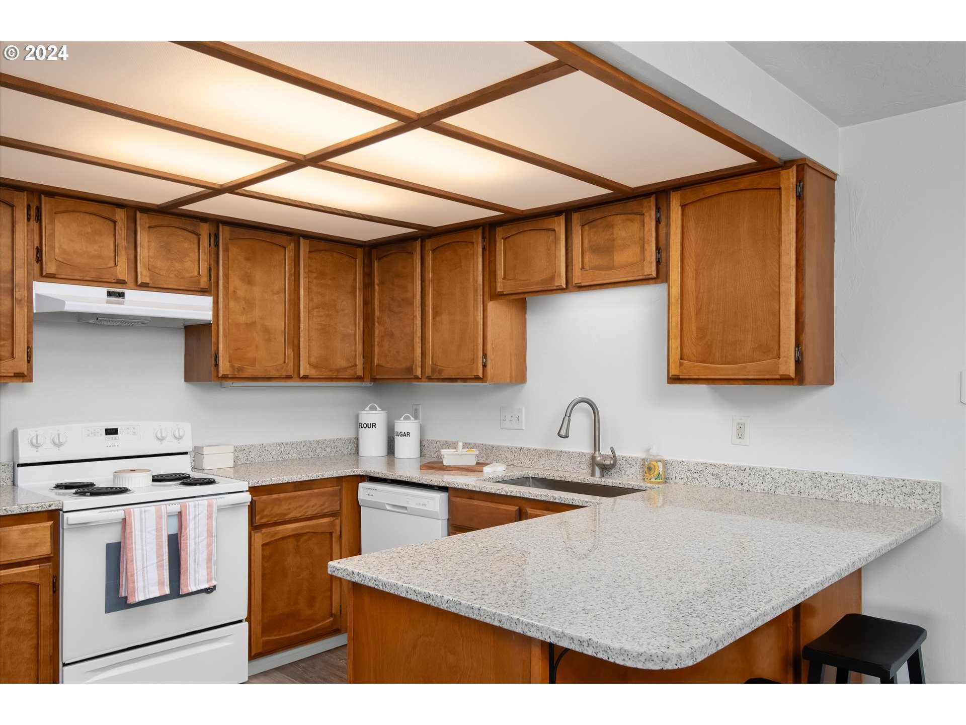 650 Harlow Road, Unit 202 Springfield, OR 97477 - Photo 10 of 34 a kitchen with stainless steel appliances granite countertop a sink a stove and cabinets