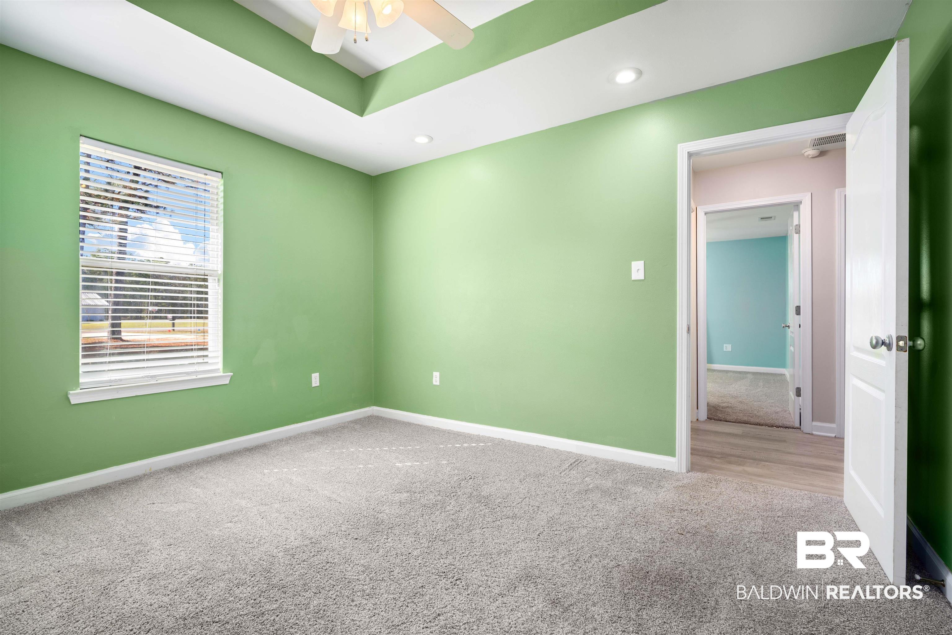 3010 Drag Strip Lane Coden, AL 36523 - Photo 21 of 44 Unfurnished room with ceiling fan and carpet flooring