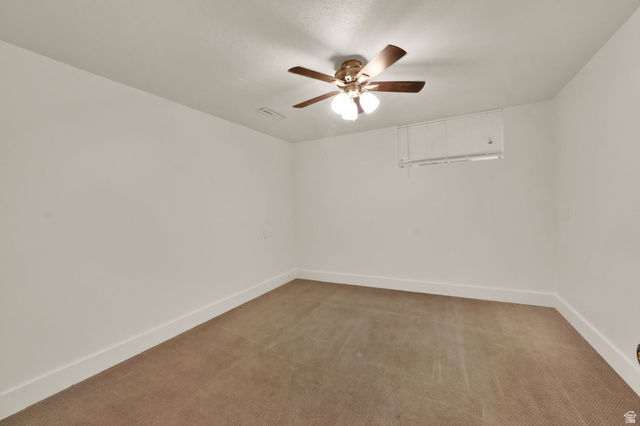 360 400 North Centerville, UT 84014 - Photo 29 of 30 Carpeted room featuring a ceiling fan with integrated lighting, white walls, and clean white baseboards
