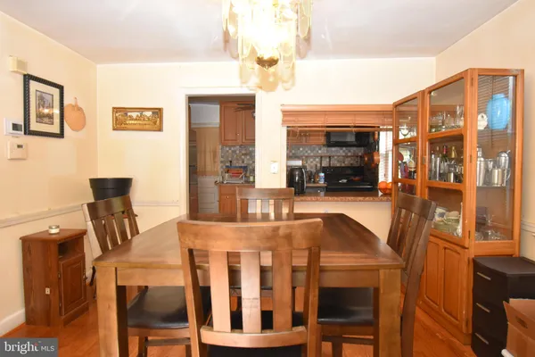 a view of a dining room with furniture and a fireplace