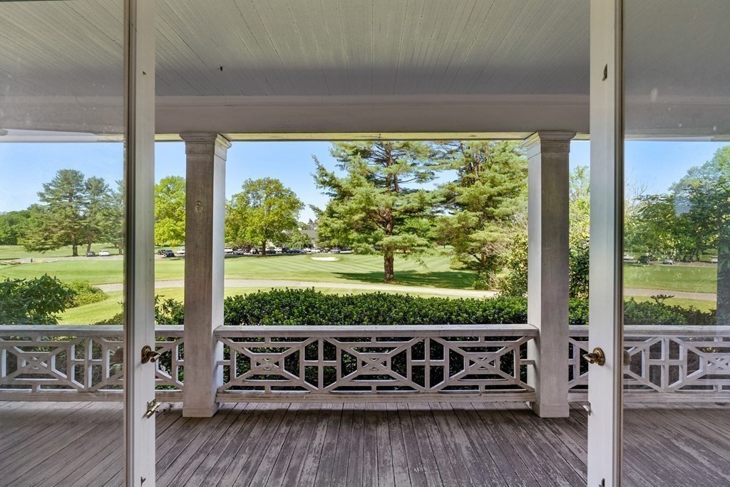 279 Meadowbrook Road Weston, MA 02493 - Photo 4 of 13 a view of a wooden bench sitting in front of a building