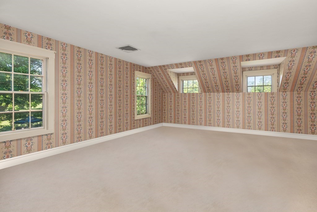 279 Meadowbrook Road Weston, MA 02493 - Photo 9 of 13 an empty room with windows