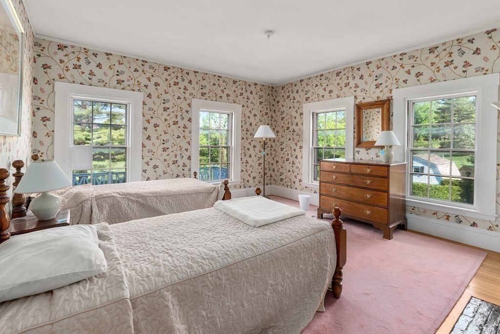 279 Meadowbrook Road Weston, MA 02493 - Photo 10 of 13 a bedroom with bed and wooden floor