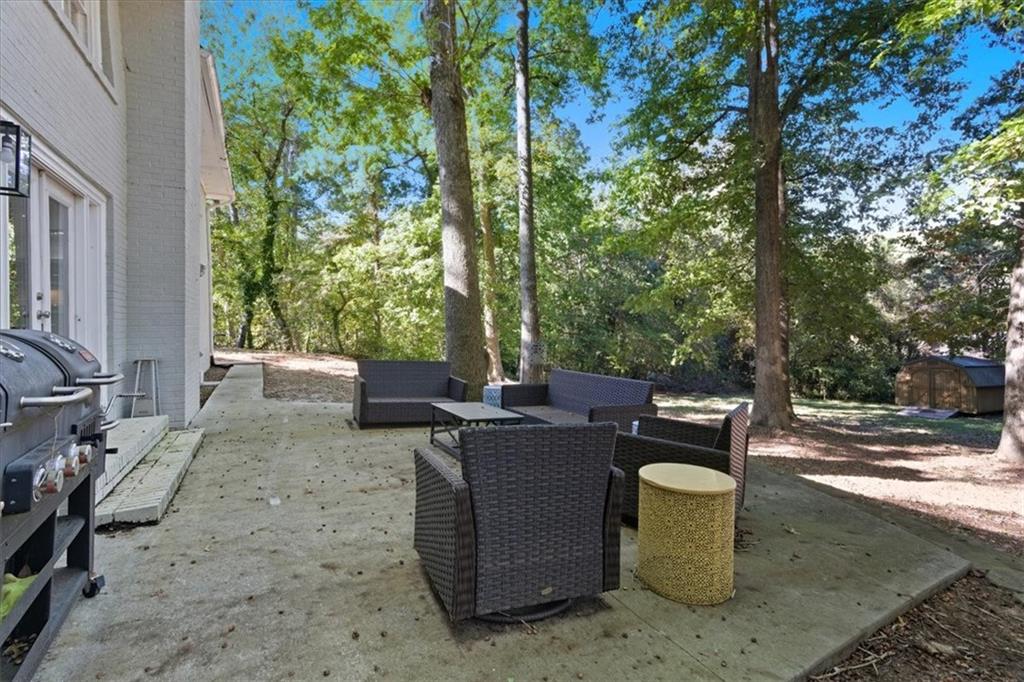 7 Thrushwood Road Northeast Rome, GA 30161 - Photo 42 of 52 a view of a backyard with sitting area