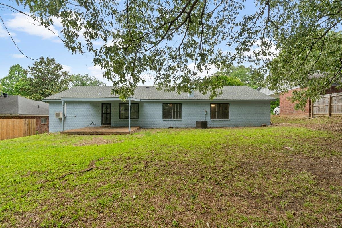 6410 Coteswood Road Memphis, TN 38134 - Photo 24 of 25 Back of house with cooling unit and a wooden deck