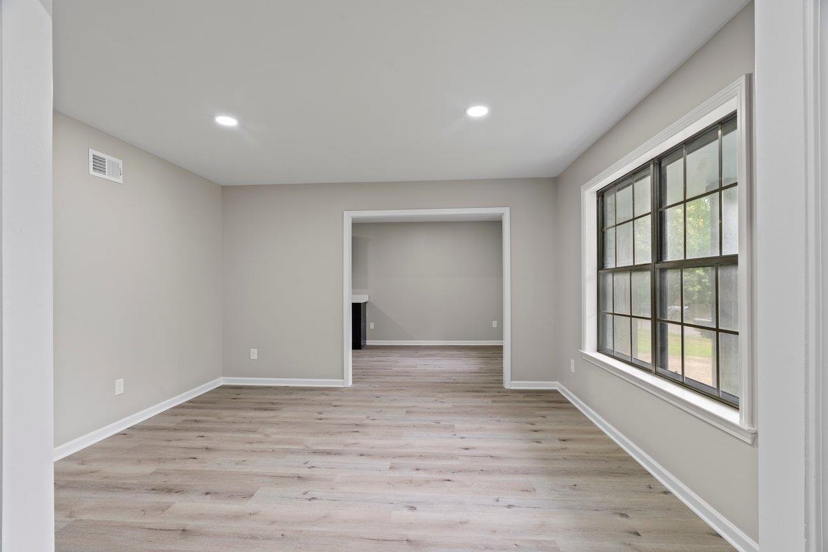 6410 Coteswood Road Memphis, TN 38134 - Photo 8 of 25 Empty room with recessed lighting, light wood finished floors, and baseboards
