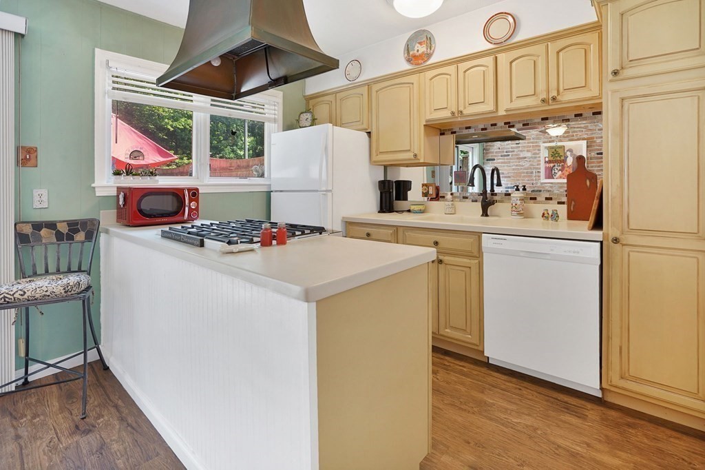 146 Jamestown Drive, Unit 146 Springfield, MA 01108 - Photo 11 of 26 a kitchen with stainless steel appliances granite countertop a sink a stove and refrigerator