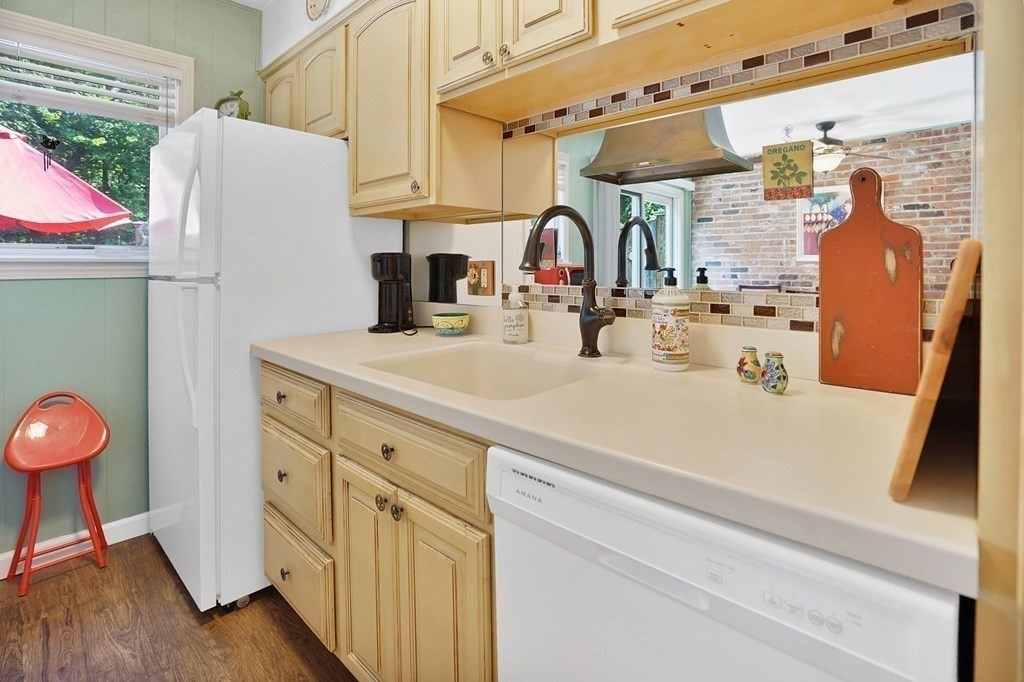 146 Jamestown Drive, Unit 146 Springfield, MA 01108 - Photo 13 of 26 a kitchen with stainless steel appliances a sink a refrigerator and a stove
