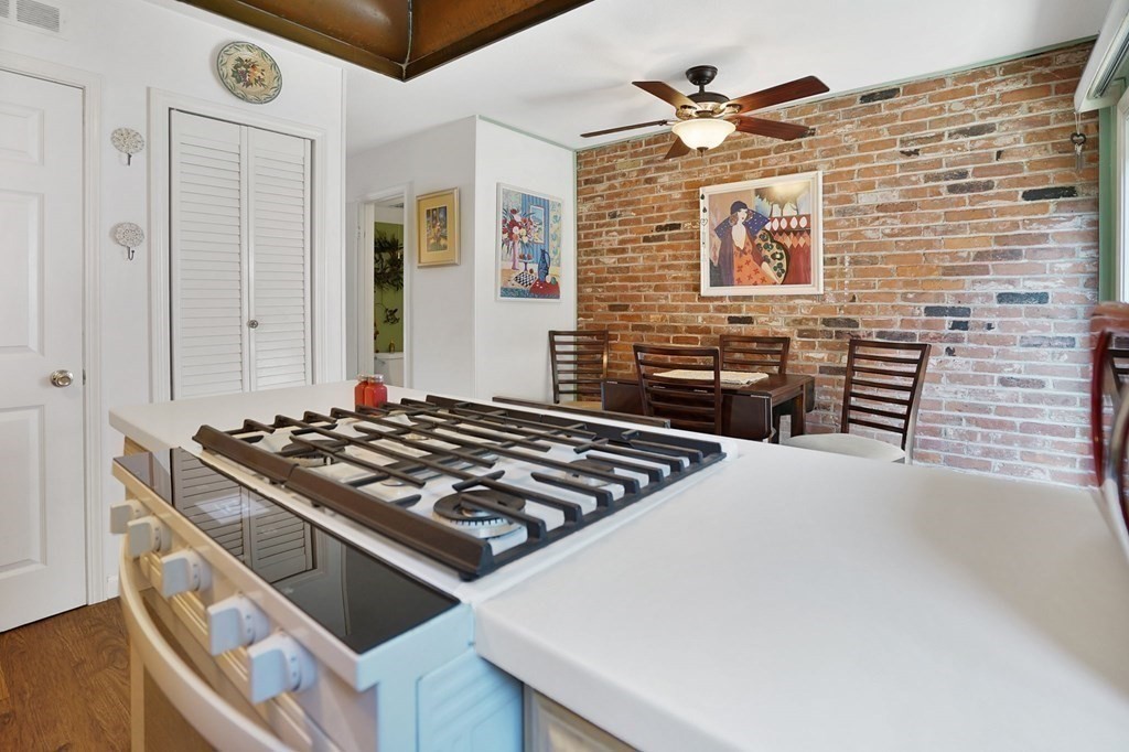 146 Jamestown Drive, Unit 146 Springfield, MA 01108 - Photo 14 of 26 a stove top oven sitting inside of a kitchen