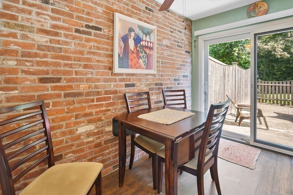 146 Jamestown Drive, Unit 146 Springfield, MA 01108 - Photo 17 of 26 a view of a dining room with furniture and wooden floor