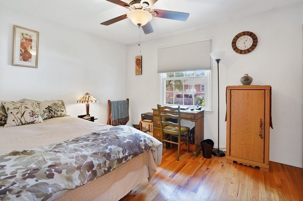 146 Jamestown Drive, Unit 146 Springfield, MA 01108 - Photo 22 of 26 a bedroom with a bed and a table