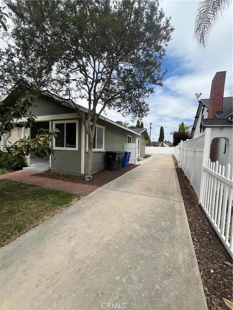 3751 Briscoe Street Riverside, CA 92506 - Photo 2 of 16 a view of a house with backyard and trees