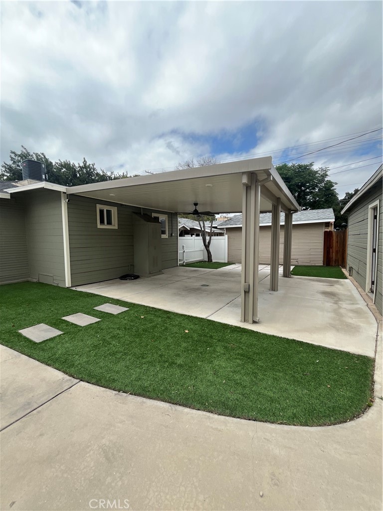 3751 Briscoe Street Riverside, CA 92506 - Photo 5 of 16 a view of a house with a yard and sitting area