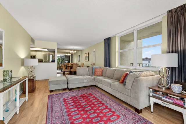 a living room with furniture and a rug
