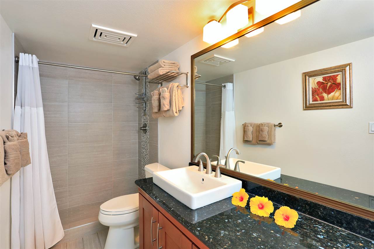 2695 South Kihei Road, Unit 10115 Kihei, HI 96753 - Photo 13 of 28 a bathroom with a sink toilet and shower