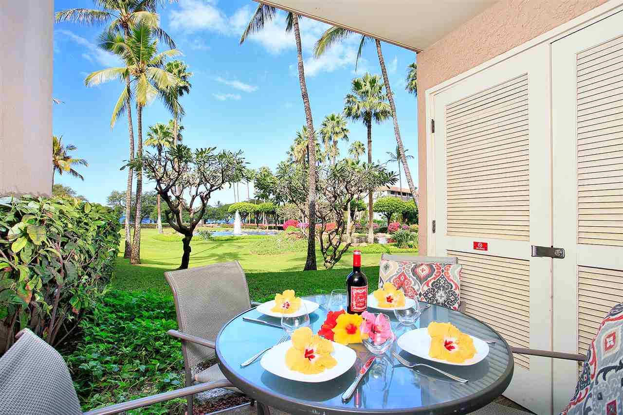 2695 South Kihei Road, Unit 10115 Kihei, HI 96753 - Photo 17 of 28 a view of a dining room with furniture and a potted plant