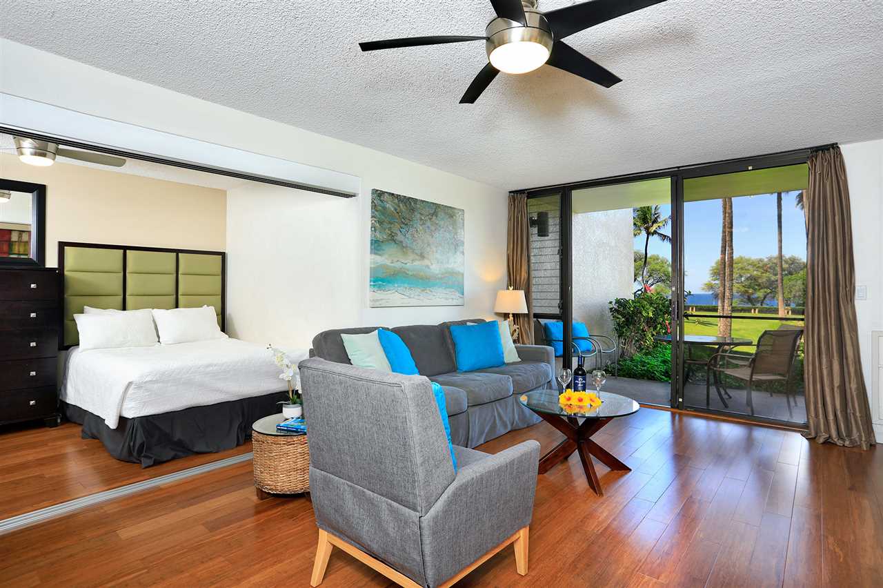 2695 South Kihei Road, Unit 10115 Kihei, HI 96753 - Photo 18 of 28 a living room with furniture and a large window