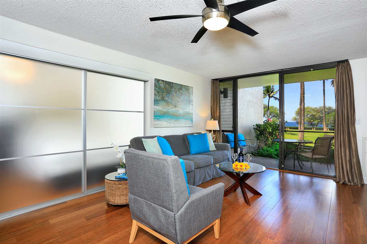 2695 South Kihei Road, Unit 10115 Kihei, HI 96753 - Photo 19 of 28 a living room with furniture and a window