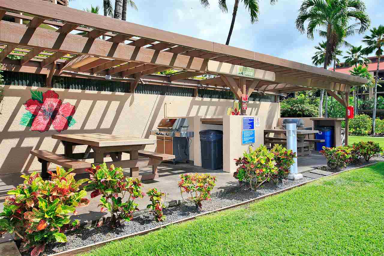 2695 South Kihei Road, Unit 10115 Kihei, HI 96753 - Photo 21 of 28 a view of a chairs and table in a patio