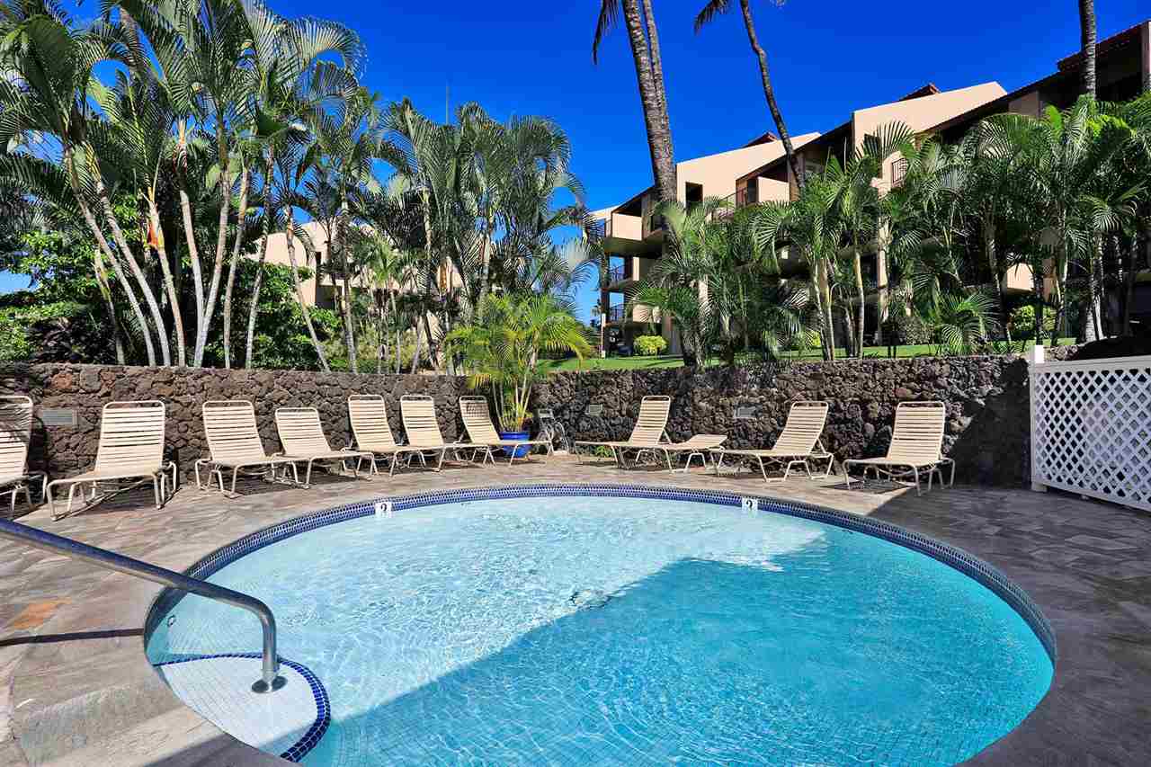 2695 South Kihei Road, Unit 10115 Kihei, HI 96753 - Photo 28 of 28 a view of a swimming pool with chairs in patio