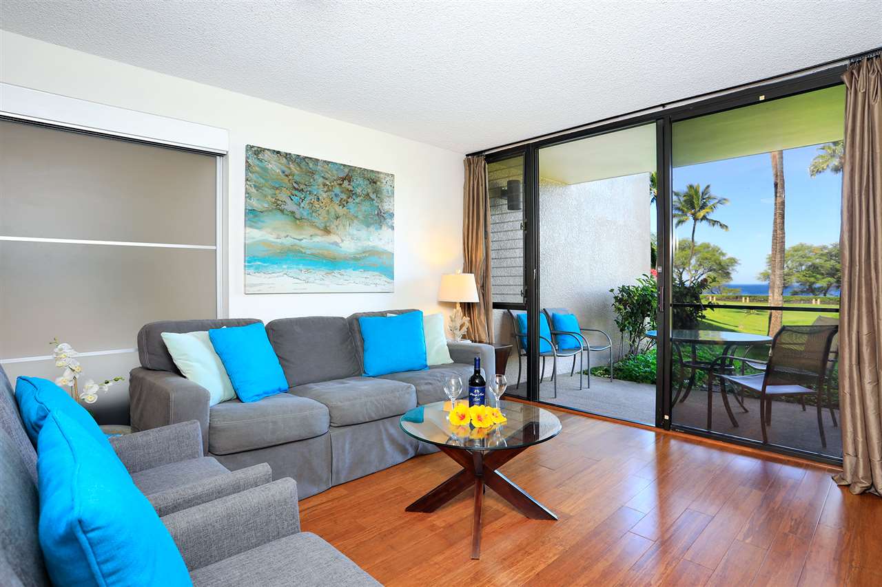 2695 South Kihei Road, Unit 10115 Kihei, HI 96753 - Photo 8 of 28 a living room with furniture and a large window