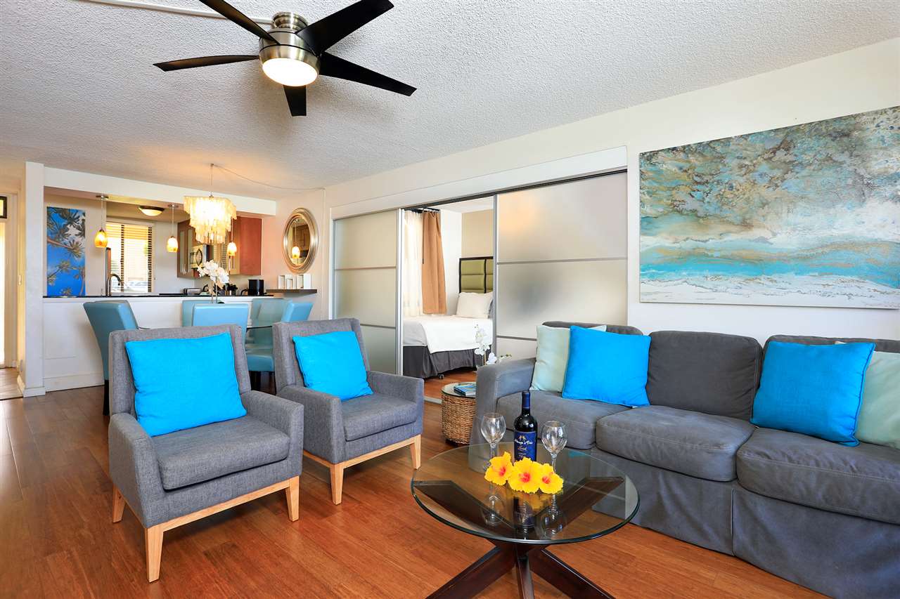 2695 South Kihei Road, Unit 10115 Kihei, HI 96753 - Photo 10 of 28 a living room with furniture and a large window