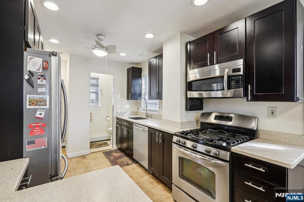 63 West Airmount Road Mahwah, NJ 07430 - Photo 11 of 20 a kitchen with stainless steel appliances granite countertop a stove and a refrigerator