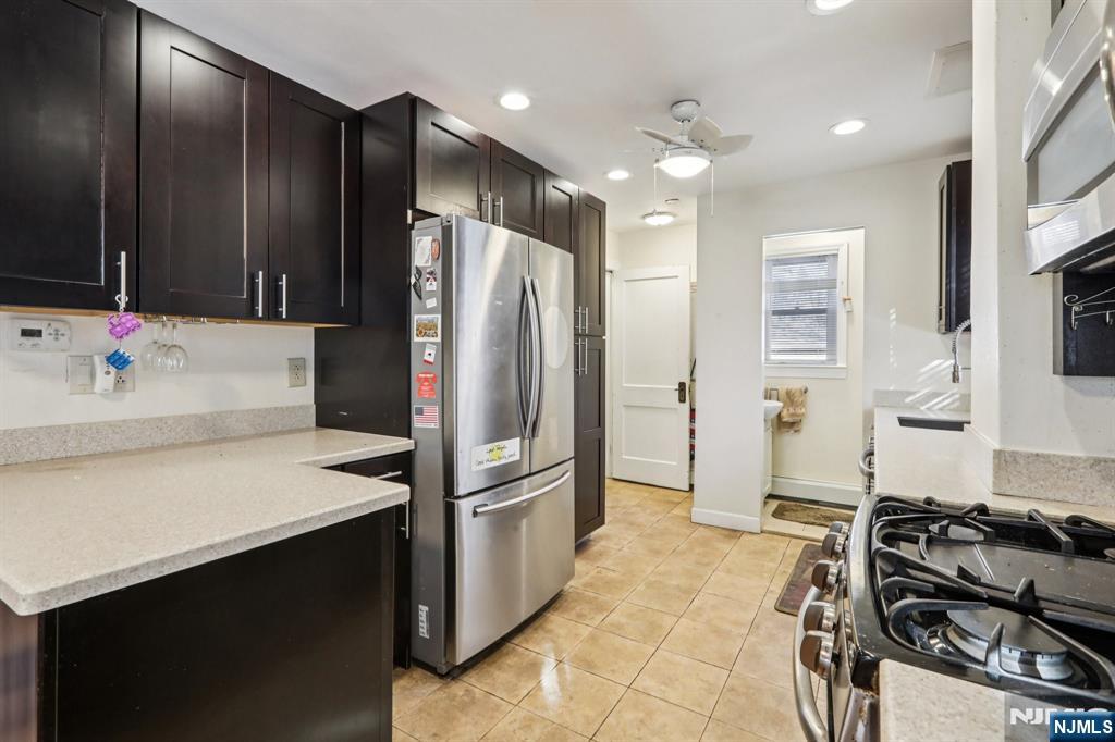 63 West Airmount Road Mahwah, NJ 07430 - Photo 12 of 20 a kitchen with a refrigerator and a sink