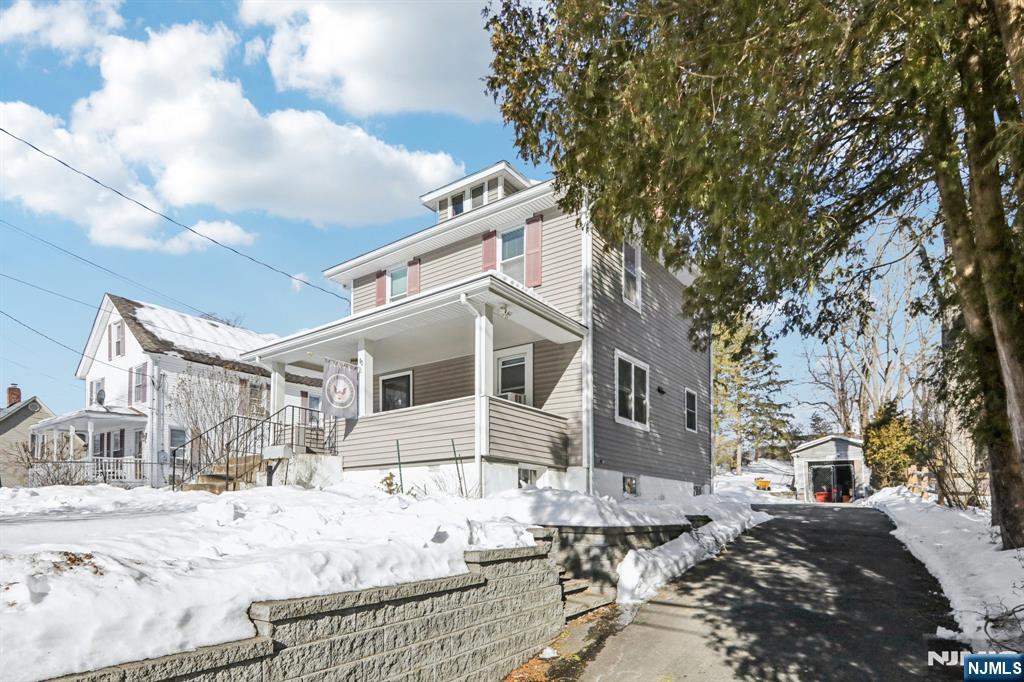 63 West Airmount Road Mahwah, NJ 07430 - Photo 3 of 20 a view of a house with snow on the road