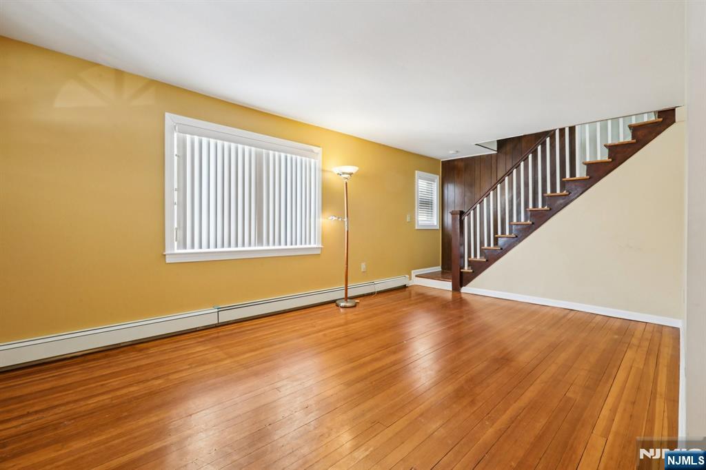 63 West Airmount Road Mahwah, NJ 07430 - Photo 6 of 20 a view of an empty room with wooden floor and a window