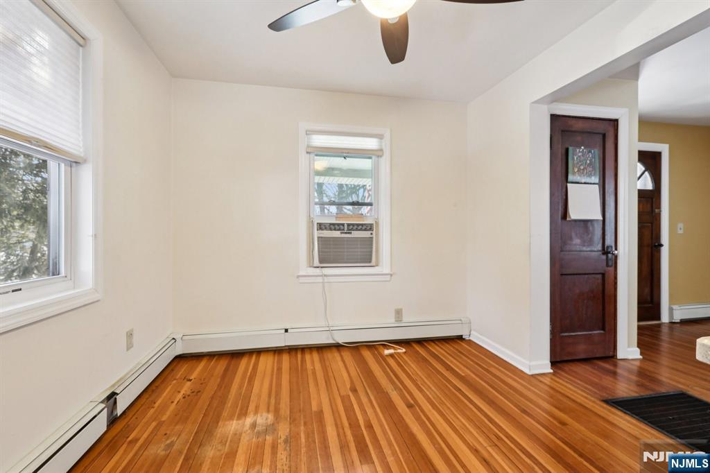 63 West Airmount Road Mahwah, NJ 07430 - Photo 7 of 20 an empty room with wooden floor fan and windows